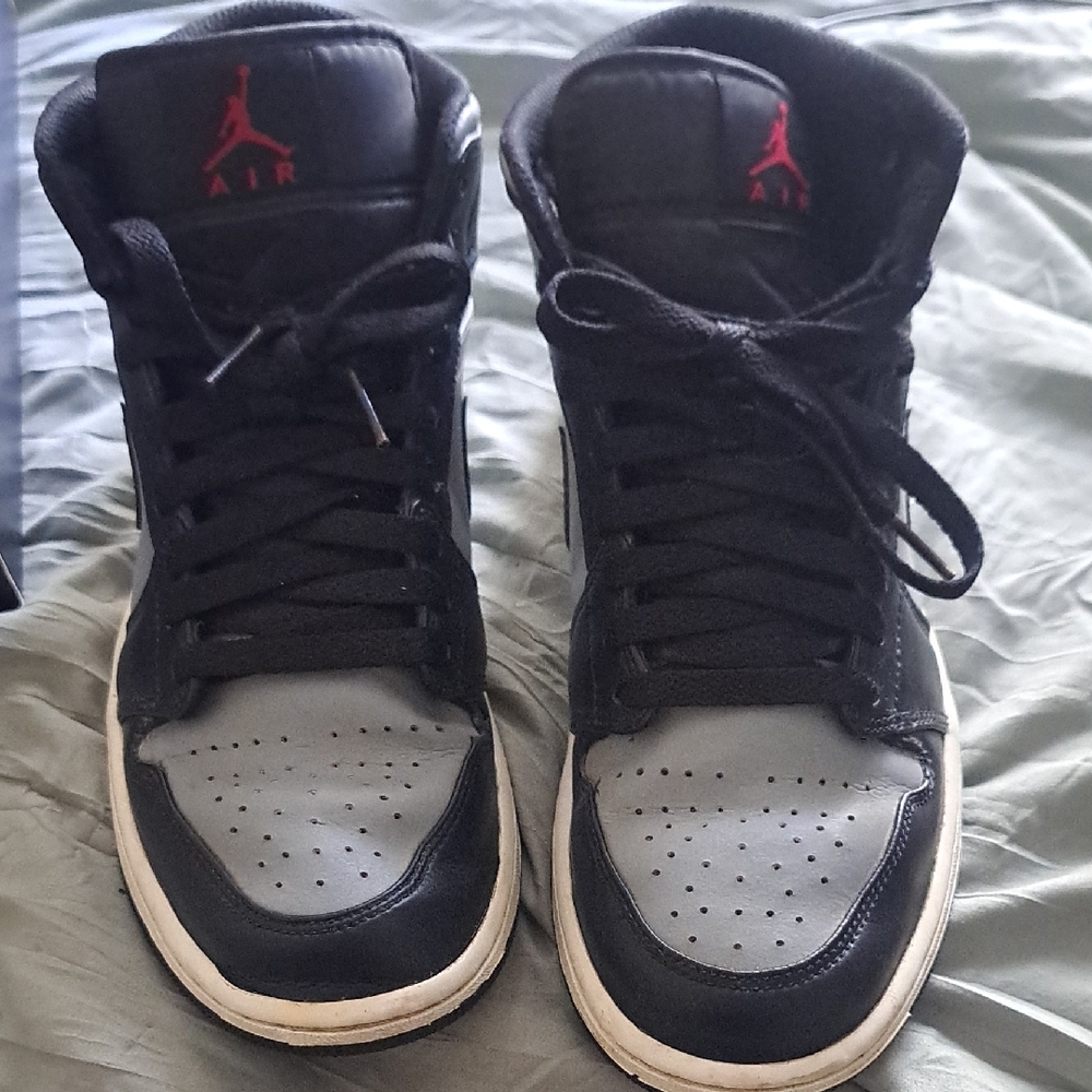 Black and Gray Sneakers with Red Accents